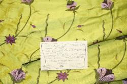 Schindlers Fabrics and Upholstery Shop Tag for this discount designer floral silk embroidery fabric