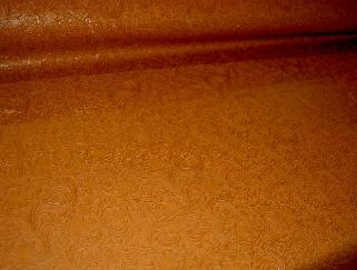 Angle view of Faux Tooled Etched Leather by the yard pattern Laredo Upholstery Vinyl Fabric Color Pottery