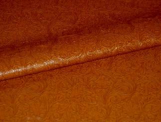 Closeup folded Faux Tooled Etched Leather by the yard pattern Laredo Upholstery Vinyl Fabric Color Pottery