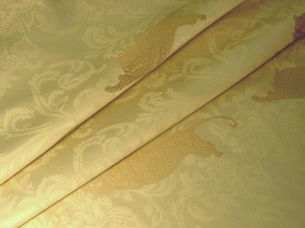 Closeup folded Jaquar Tapestry Pattern on Cream Damask Background Fabric Shop Discount Special by the yard